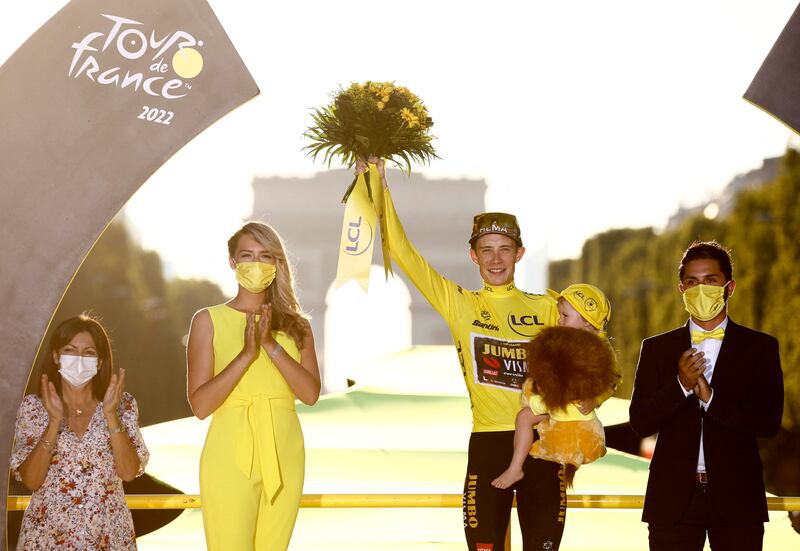 Jumbo-Visma's Jonas Vingegaard celebrates on the podium after winning the 2022 Tour de France, on Sunday, July 24. Reuters