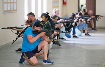 People take part in civilian military training in Odesa, southern Ukraine. EPA 