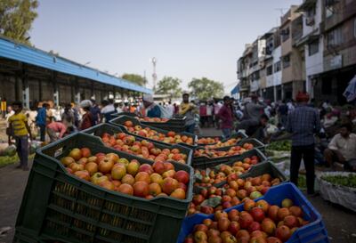 Tomatoes in crates along a street at the Azadpur wholesale market in New Delhi, India. Tabreed expects to grow its business in India. Bloomberg
