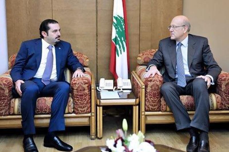 Najib Mikati, right, with Saad Hariri in Beirut last year. Wael Hamzeh / AFP