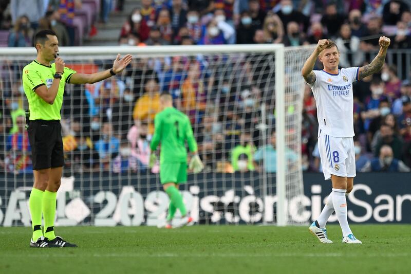 Real Madrid midfielder Toni Kroos celebrates victory a 2-1 victory at the end of the clasico at Camp Nou on October 24, 2021. AFP