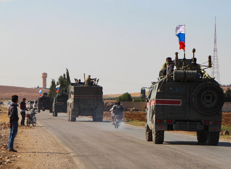 A convoy of Russian military vehicles drives toward the northeastern city of Kobani.  Russian forces in Syria headed for the border with Turkey today to ensure Kurdish fighters pull back after a deal between Moscow and Ankara wrested control of the Kurds' entire heartland. AFP