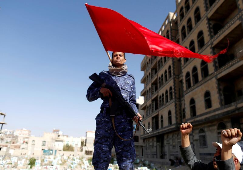FILE PHOTO: A Shiite Houthi fighter stands guard at the site of a rally attended by fellows Houthis to mark Ashura and the 4th anniversary of their takeover of the Yemeni capital, in Sanaa, Yemen, September 20, 2018. REUTERS/Khaled Abdullah/File Photo