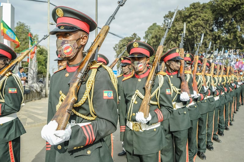 Members of National Defence Force stands on guard during the celebration of the 125th victory of Adwa, at Menelik square in Addis Ababa, Ethiopia, on March 2, 2021. The Battle of Adwa was the climactic battle of the First Italo-Ethiopian War. The Ethiopian forces defeated the Italian invading force on March 1, 1896, near the town of Adwa. The decisive victory thwarted the campaign of the Kingdom of Italy to expand its colonial empire in the Horn of Africa. / AFP / Amanuel Sileshi

