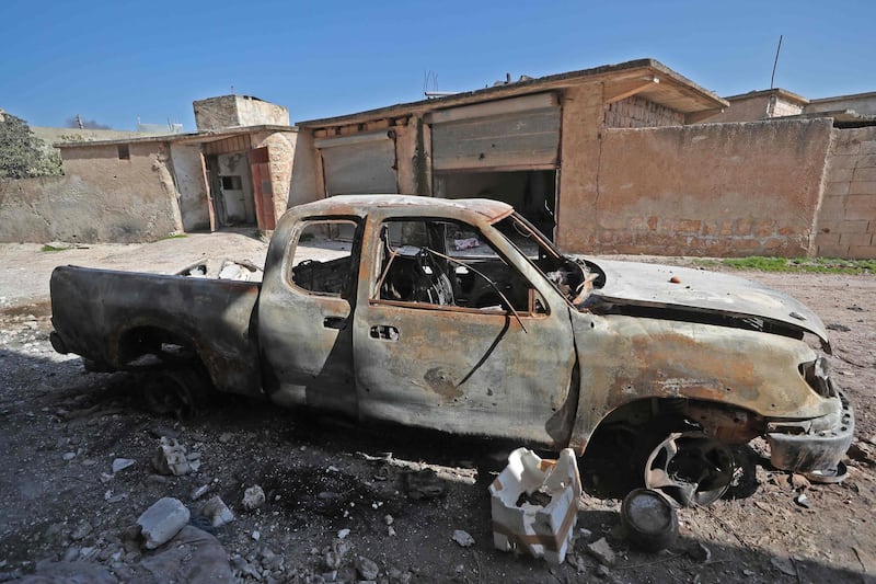 A burnt vehicle in the village of al-Nayrab. AFP