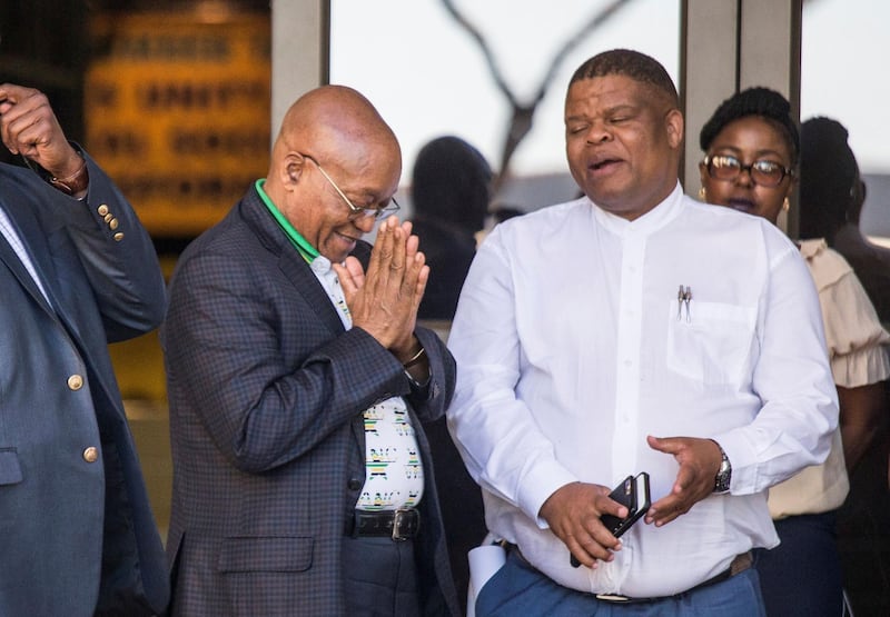 South African President and ANC president Jacob Zuma (C) gestures prior to a meeting ahead of the 54th National Conference of South Africa's leading party African National Congress (ANC) at Nasrec Expo Centre in Johannesburg on December 14, 2017. 
The party's national conference will take place from December 16 to December 20, 2017. / AFP PHOTO / WIKUS DE WET
