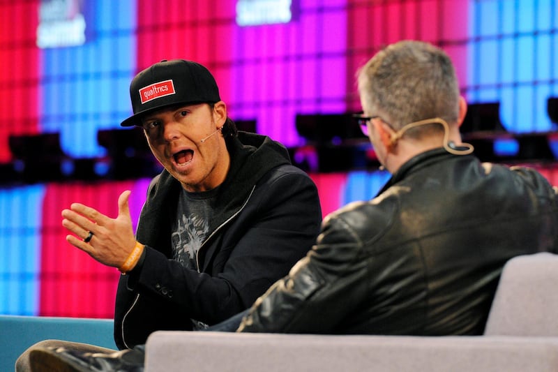 DUBLIN, IRELAND - NOVEMBER 05:  Ryan Smith, Co-Founder and CEO of Qualtrics peaks on stage during the third day of the 2015 Web Summit on November 5, 2015 in Dublin, Ireland. The Web Summit is now in it's 4th year and is technology's most global gathering. In numbers, it has 42,000 attendees from 134 countries, 1,000 speakers, 2,100 startups and 1,200 media.  (Photo by Clodagh Kilcoyne/Getty Images)