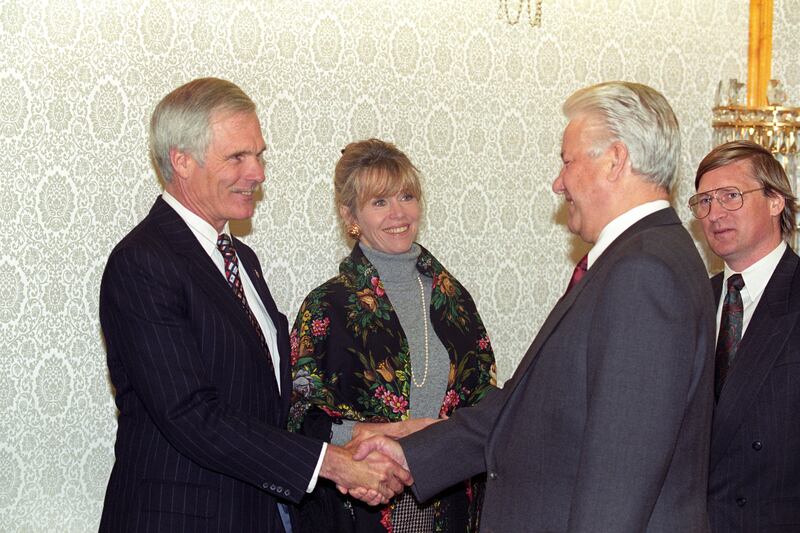 Jane Fonda, in a grey turtleneck jumper and floral cardigan, meets Russian president Boris Yeltsin with Ted Turner in Moscow, Russia, on October 23, 1993