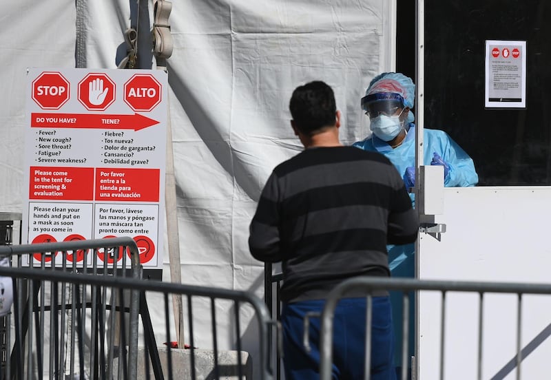 A medical worker walks out of a coronavirus testing tent at Brooklyn Hospital Centre in New York City. AFP
