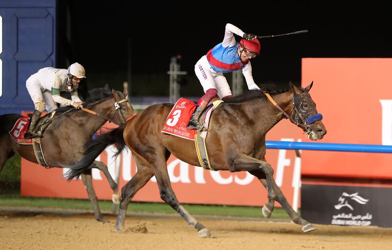 Frankie Dettori celebrates after winning the Dubai World Cup on Country Grammer. Pawan Singh / The National