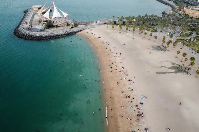 People at the beach trying to escape the heat in Kuwait City. AFP
