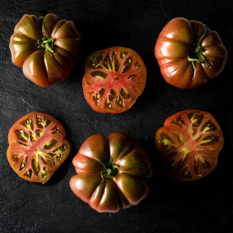 A variety of tomatoes are on sale, including pineapple, black cremian, marmande and beef heart, amongst others. Courtesy Les Gastronomes