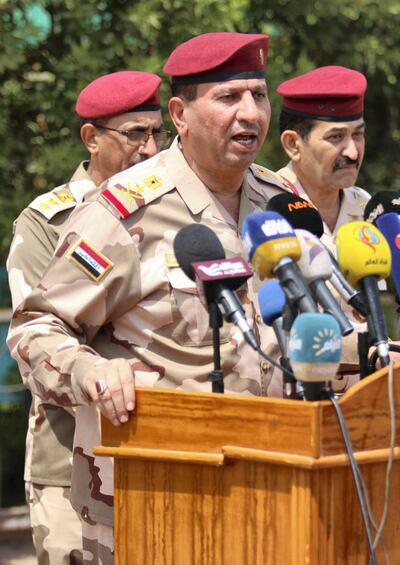 Staff General Jamil al-Shammari (C), Basra security operations commander, gives a press conference at the oeprations command headquarters in the southern city on September 5, 2018. (Photo by Haidar MOHAMMED ALI / AFP)