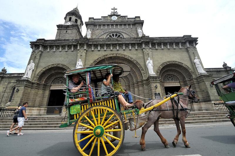 Above, the Manila Cathedral in Intramuros of the Philippines' capital. Noel Celis / AFP