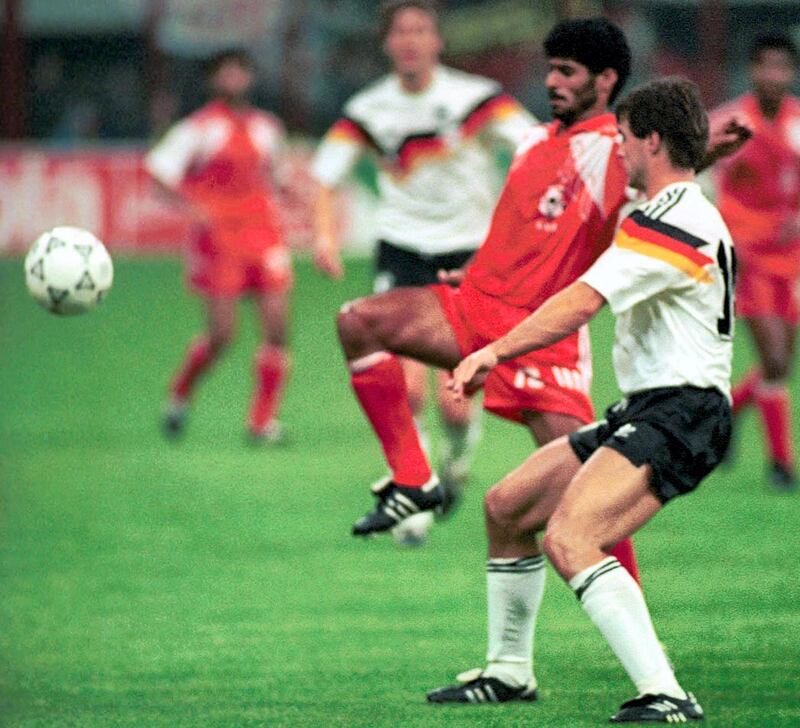 TO GO WITH AFP 2010 WORLD CUP PACKAGE IN ARABIC
(FILES) A picture taken on June 15, 1990 shows UAE's Adnan al-Talyani challengind Germany's Guido Buchwald during the World Cup Group D first round match between United Arab Emirates and West Germany at the Giuseppe Meazza stadium in San Siro, Italy. AFP PHOTO/NADER DEL RIO / AFP PHOTO / FILES / NADER DEL RIO