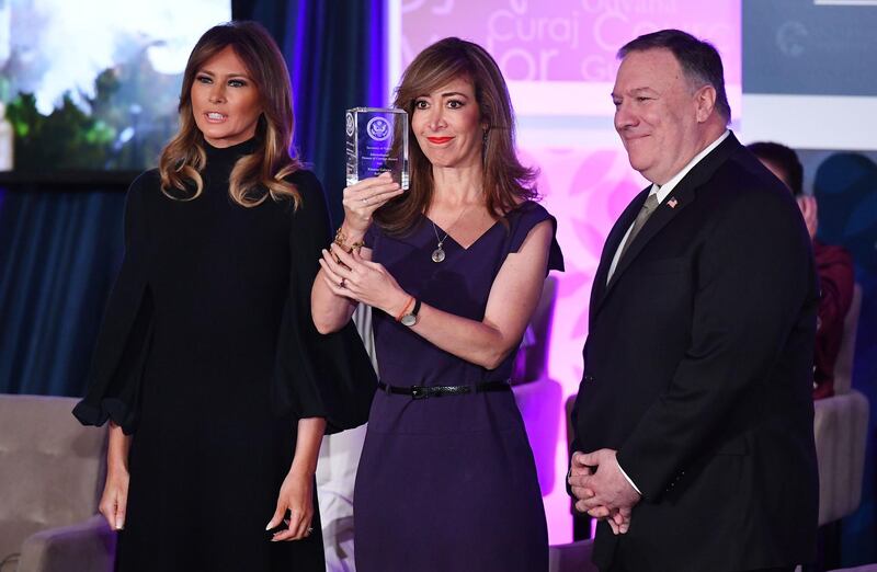 International Women of Courage Award recipient Ximena Galarza of Bolivia poses with US Secretary of State Mike Pompeo and First Lady Melania Trump.  AFP