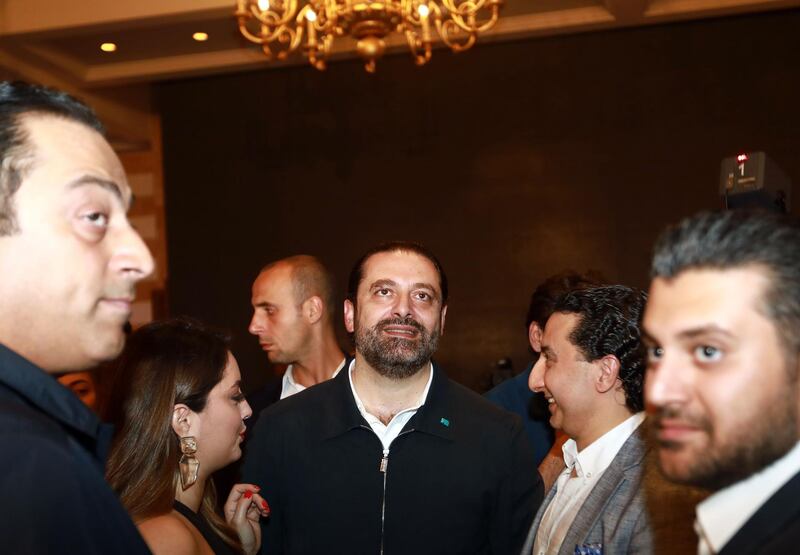 Lebanese Prime Minister Saad Hariri greets supporters in his house in downtown Beirut while waiting for the electoral results on May 6, 2018.
Lebanon held a much-delayed general election Sunday, with a new civil society list hoping for a breakthrough but traditional parties expected to renew their fragile power-sharing bargain. / AFP PHOTO / ANWAR AMRO