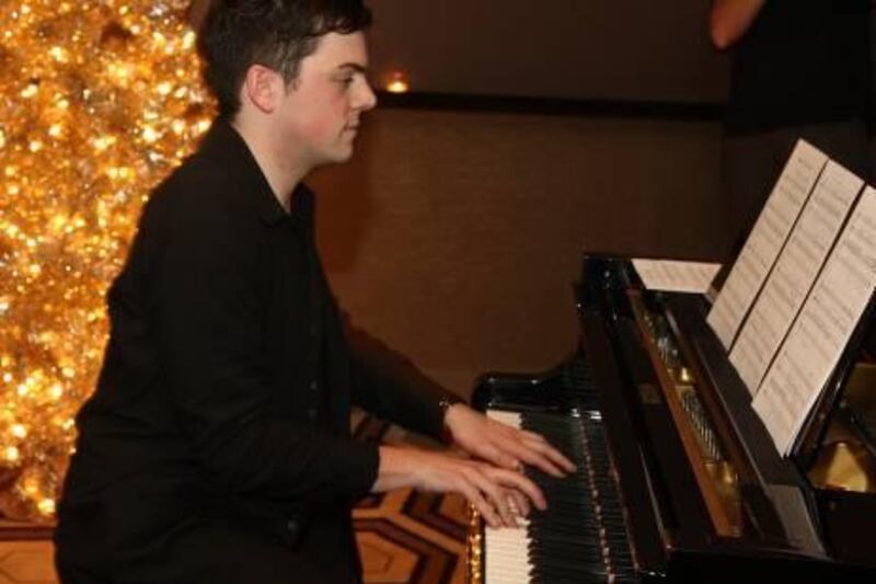 NEW YORK - DECEMBER 18: Composer Nico Muhly performs at a private screening of "The Reader" hosted by Diane Von Furstenberg and Philip Glass at The Tribeca Grand Hotel on December 18, 2008 in New York City.   Stephen Lovekin/Getty Images for The Weinstein Company/AFP