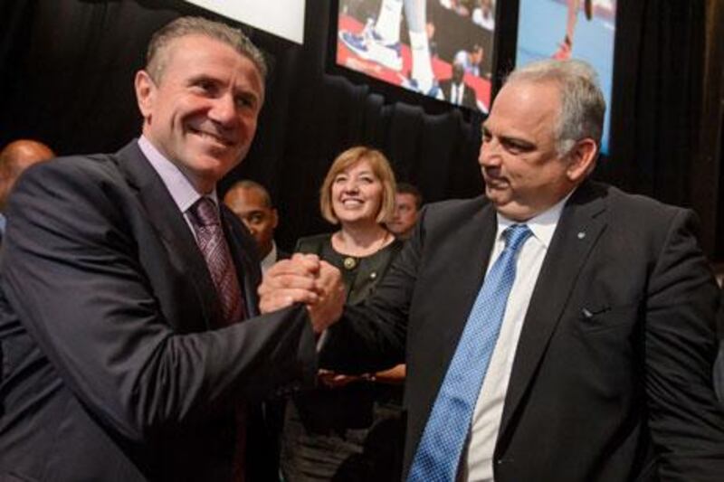 Nenad Lalovic, right, the Wrestling Federation president, and Sergey Bubka, the Ukrainian pole vault legend, celebrate the re-inclusion of wrestling into the Olympics. Fabrice Coffrini / AFP