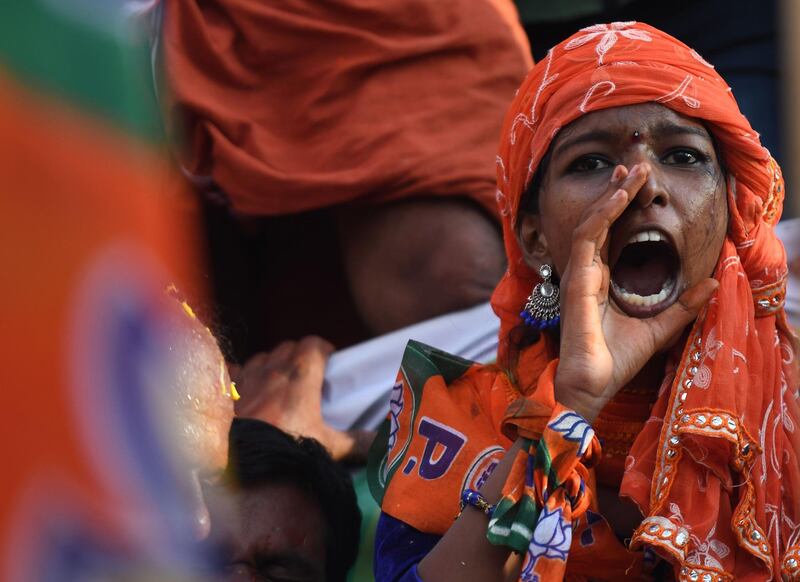 In this photo taken on April 21, 2019 an Indian woman supporting the Bharatiya Janata Party (BJP) shouts slogans during the final day of election campaigning in the city of Pathanamthitta, in the south Indian state of Kerala. Voters in a flashpoint constituency in southern India went to the polls on April 23 after a campaign dominated by the fallout from the controversial decision to allow women to enter a Hindu temple. Traditionalists were outraged and many women remain divided over the move, which has overshadowed the campaign with candidates staging election parades on the issue.
 - To go with INDIA-VOTE-KERALA-WOMEN,SCENE by Bhuvan BAGGA 
 / AFP / ARUN SANKAR / To go with INDIA-VOTE-KERALA-WOMEN,SCENE by Bhuvan BAGGA 
