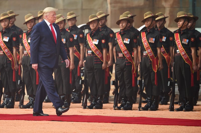 US President Donald Trump reviews a guard of honour during a ceremonial reception at Rashtrapati Bhavan, the Presidential Palace, in New Delhi. AFP