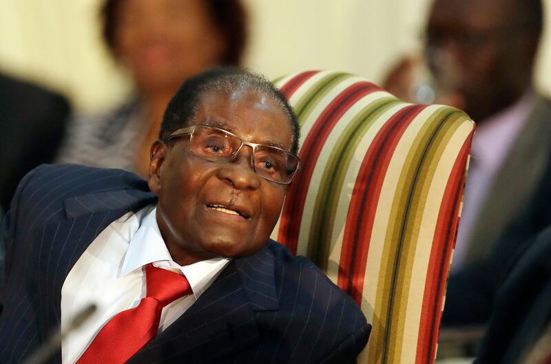 FILE - In this file photo dated Tuesday, Oct. 3, 2017, Zimbabwe's President Robert Mugabe, during his meeting with South African President Jacob Zuma, at the Presidential Guesthouse in Pretoria, South Africa.  Zimbabwe President Robert Mugabe has long faced United States sanctions over his government's human rights abuses, but the World Health Organization new director-general Tedros Ghebreyesus is making the longtime African leader a "goodwill ambassador" Friday Oct. 20, 2017.(AP Photo/Themba Hadebe)