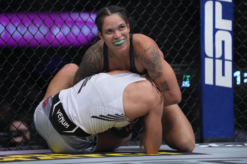 Amanda Nunes applies a hold against Julianna Pena. Reuters