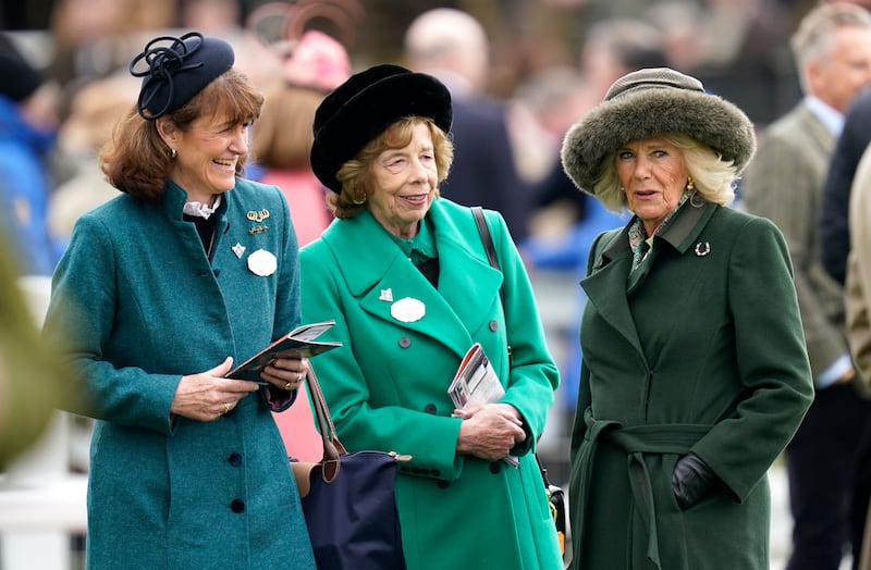 Queen Camilla, right, with long-standing friend Lady Sarah Keswick, centre, at Cheltenham Racecourse this week. PA