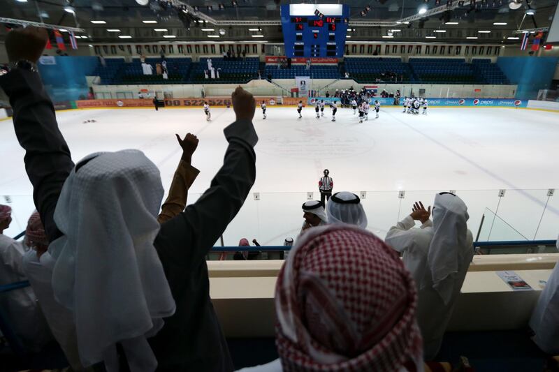 Abu Dhabi, United Arab Emirates, March 17, 2014:      UAE supporters celebrate Saeed Al Nuaimi, not pictured, scoring the winning goal in overtime against Thailand during their Challenge Cup Cup of Asia game at the Zayed Sports City Ice Rink in Abu Dhabi on March 17, 2014. Christopher Pike / The National

Reporter: Amith Passela
Section: Sport