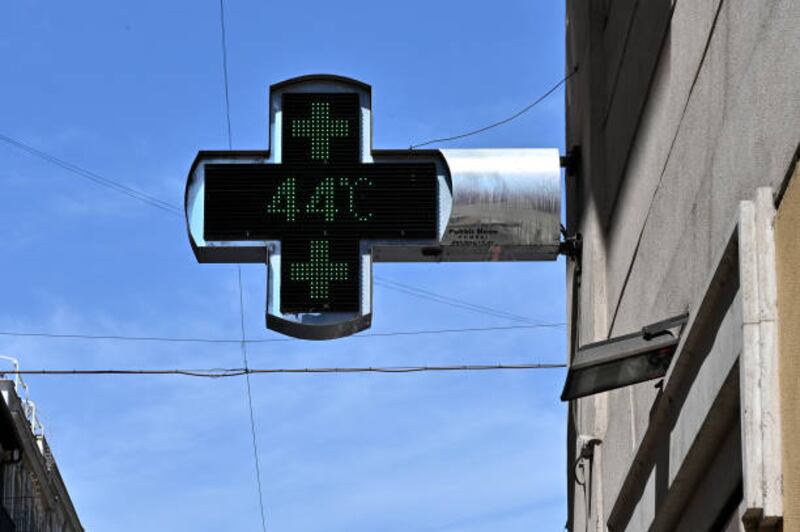 A thermometer outside a pharmacy reads 44°C in central Rome. AFP via Getty Images
