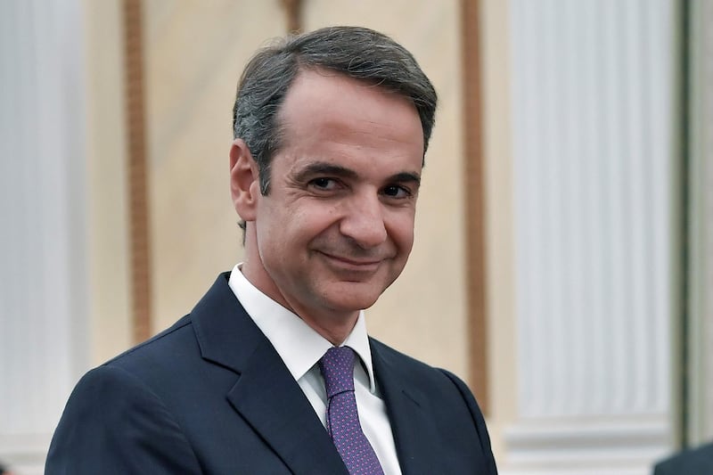 Leader of New Democracy conservative party and winner of Greek general election Kyriakos Mitsotakis smiles during his swearing-in ceremony as a prime minister of Greece at the presidental palace in Athens on July 8, 2019. Greece's new prime minister, Kyriakos Mitsotakis, formally takes up the reins on July 8, a day after an election victory that puts him in charge of the EU's most indebted member with promises to end a decade of economic crisis.
 / AFP / Louisa GOULIAMAKI
