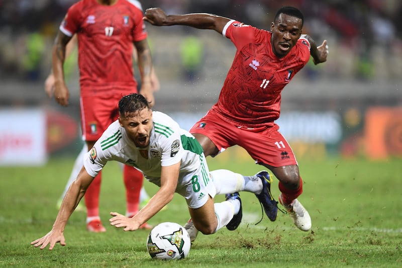 Equatorial Guinea defender Basilio Ndong fights for the ball with Algeria forward Youcef Belaili. AFP