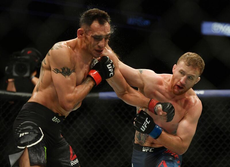 Justin Gaethje lands a punch on Tony Ferguson at UFC 249. Reuters