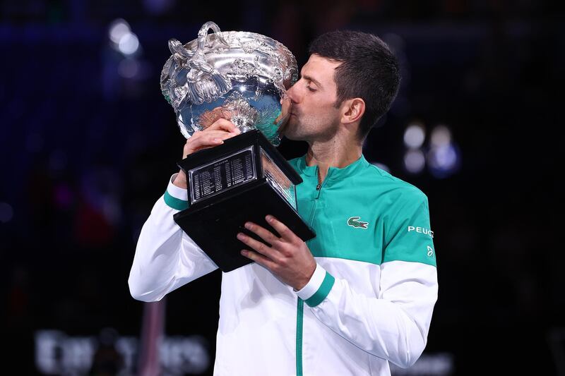 Novak Djokovic kisses the Norman Brookes Challenge Cup after beating Daniil Medvedev in straight sets to win the Australian Open at Melbourne Park on Sunday, February 21. Getty