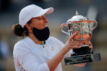 Iga Swiatek holds the Suzanne-Lenglen Cup after beating Sofia Kenin to win the French Open. PA