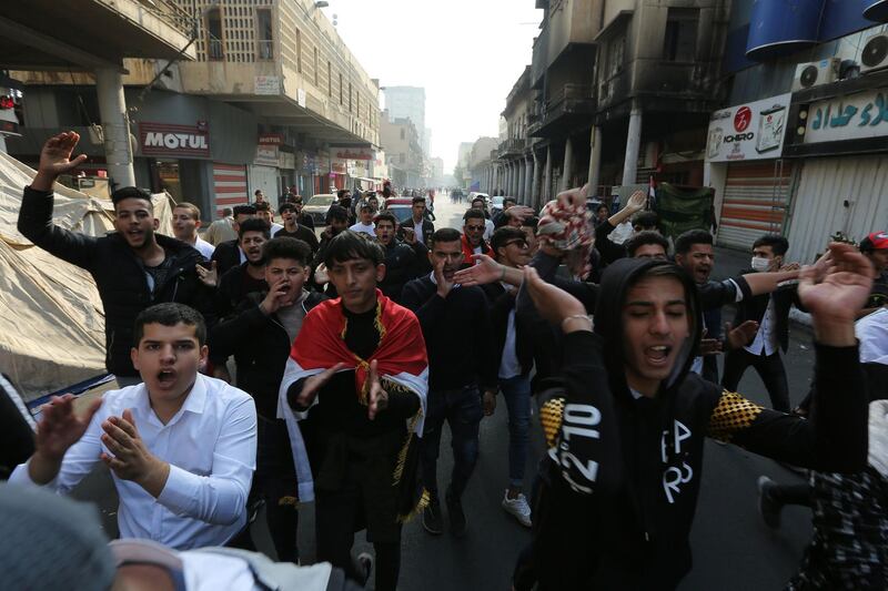 Iraqi protesters chant slogans during a demonstration in Baghdad's al-Rasheed street near al-Ahrar bridge.  AFP