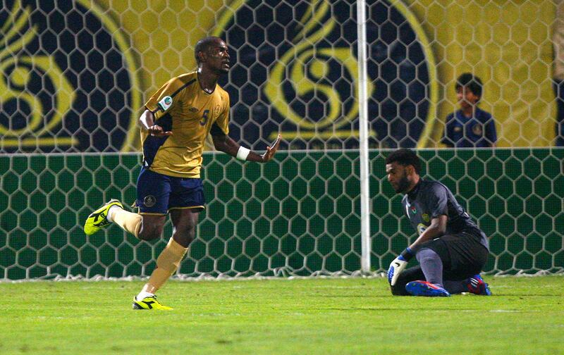 Simon Pierre Feindouno of Dubai celebrates scoring his side's first goal during the Etisalat Pro League match between Dubai and Al Wasl at Dubai Sports & Cultural club Stadium, Dubai on the 9th November 2012. Credit: Jake Badger for The National