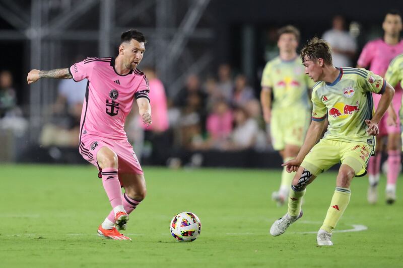 Lionel Messi on the ball as Red Bulls midfielder Daniel Edelman attempts to close him down. AFP