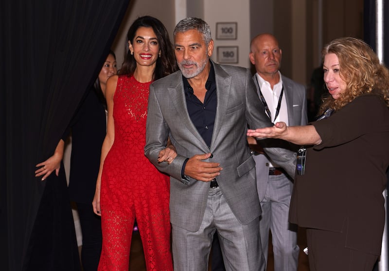 Human rights lawyer Amal Clooney and actor husband George Clooney arrive at HistoryTalks in Washington.