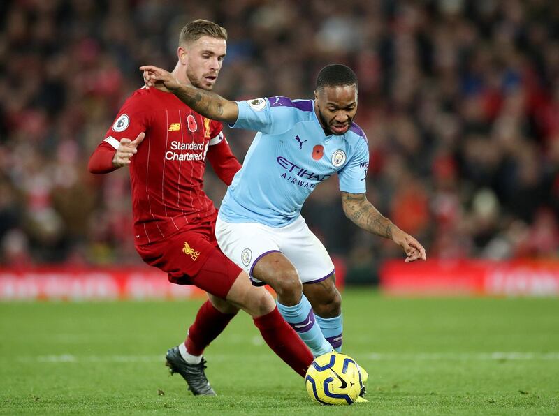 Manchester City's Raheem Sterling tackles with Liverpool's Jordan Henderson at Anfield. Reuters