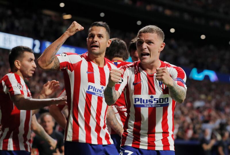 Atletico Madrid's Kieran Trippier, right, celebrates after teammate Hector Herrera scores their second goal. Reuters