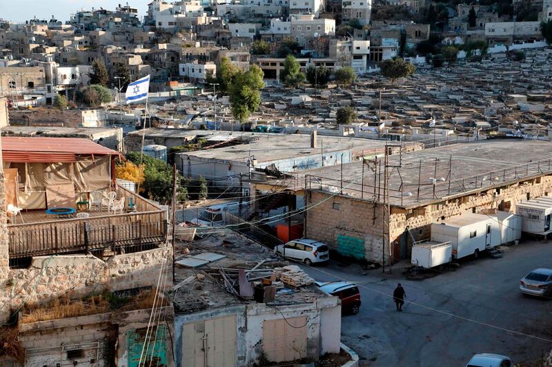 An old market building (R) along al-Shuhada street in the flashpoint city of Hebron in the occupied West Bank. AFP