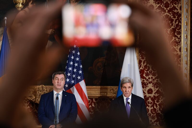 Bavaria's state governor Markus Soder, left, and former US secretary of state John Kerry at a dinner reception at the Munich royal residence. Getty Images