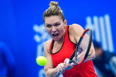 Simona Halep of Romania hits a return against Nicole Gibbs of the US in the first round of the Shenzhen Open tennis tournament in Shenzhen, in China's southern Guangdong province on January 1, 2018. / AFP PHOTO / - / China OUT