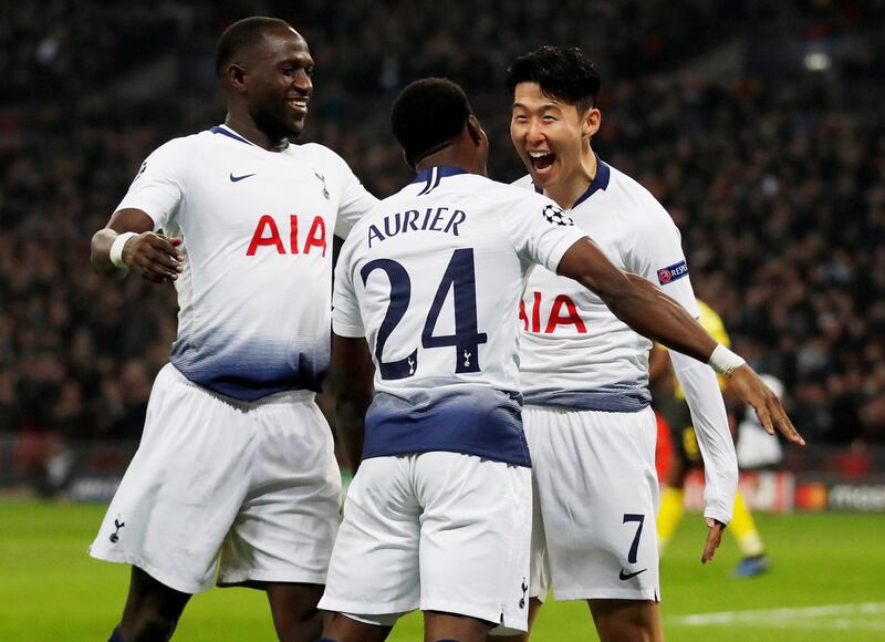 Soccer Football - Champions League Round of 16 First Leg - Tottenham Hotspur v Borussia Dortmund - Wembley Stadium, London, Britain - February 13, 2019  Tottenham's Son Heung-min celebrates scoring their first goal with Serge Aurier and Moussa Sissoko   Action Images via Reuters/Matthew Childs     TPX IMAGES OF THE DAY