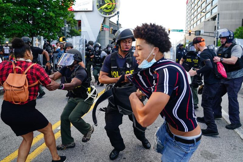 Police clash with demonstrators while making arrests during a protest in response to the police killing of George Floyd in Atlanta, Georgia. AFP