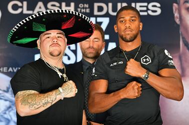 WBA, IBF, WBO and IBO heavyweight champion Andy Ruiz Jr, left, will defend the belts he won off Anthony Joshua when the two fighters meet again at the "Clash on the Dunes" in December. AFP