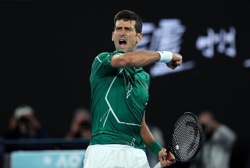 MELBOURNE, AUSTRALIA - JANUARY 30: Novak Djokovic of Serbia celebrates after winning set point during his Men's Singles Semifinal match against Roger Federer of Switzerland on day eleven of the 2020 Australian Open at Melbourne Park on January 30, 2020 in Melbourne, Australia. (Photo by Clive Brunskill/Getty Images)