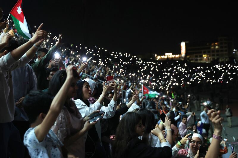 People enjoy a free concert to celebrate the wedding of Jordan's Crown Prince at Amman International Stadium last month. AFP