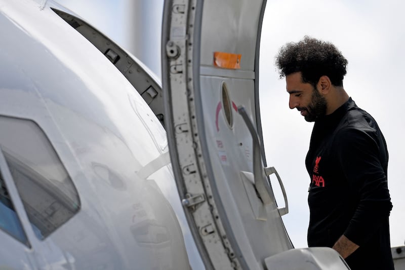 Liverpool's Egyptian star Mohamed Salah boards the plane at John Lennon Airport on Friday before leaving for the Champions League final. AFP